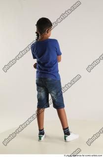 TIMBO STANDING POSE WITH GUN